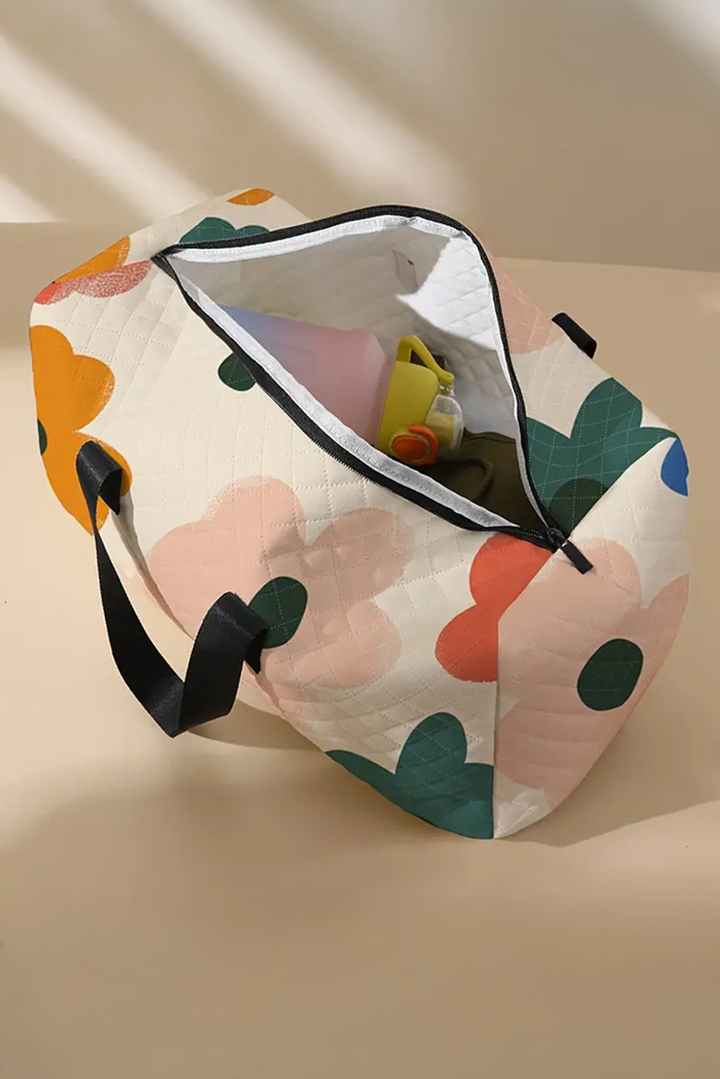 Quiltad blommig duffelväska